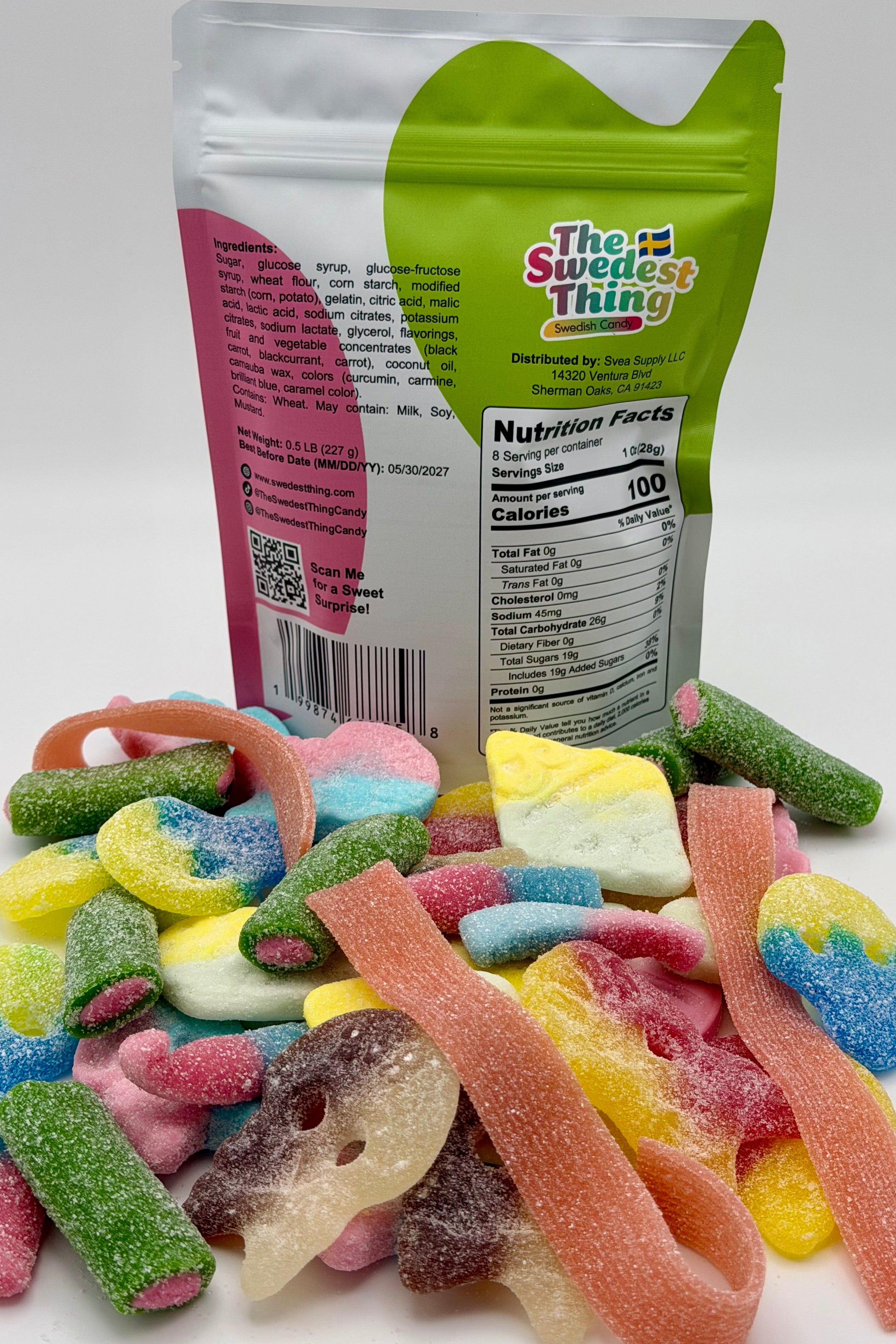 Colorful gummy candies in front of a 'The Swedest Thing' branded packaging on a white background